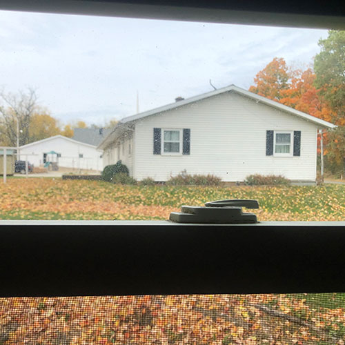 view of parsonage through a window
