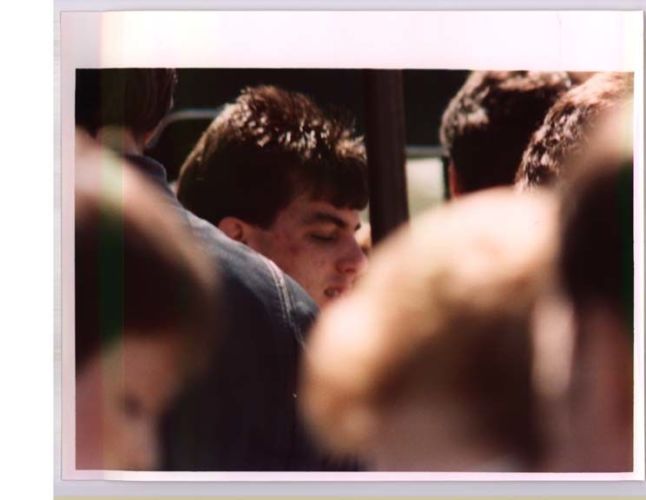 Jeff Pelley surrounded by a group of people
