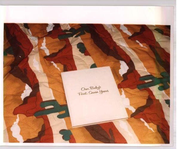 baby book lying on a bed