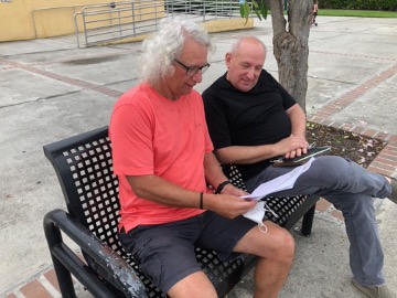Michael Braun and Sheldon Zoldan talking on a bench