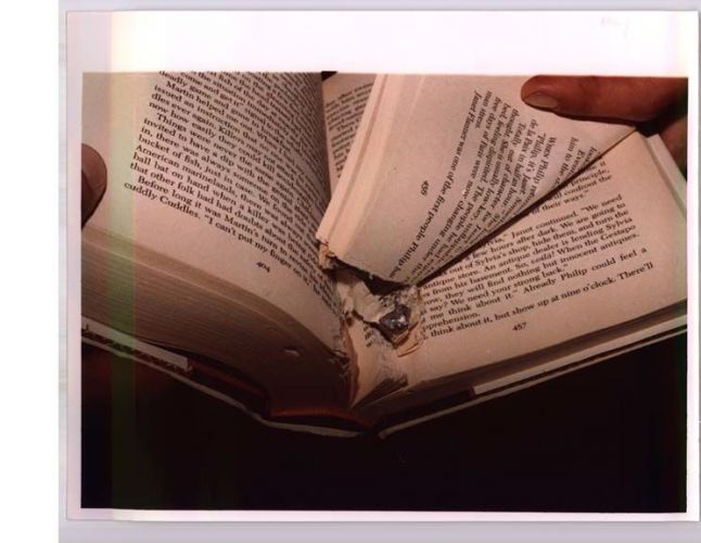 open book with torn pages