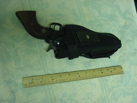 Evidence Photo of John Welles’s .22 Ruger Revolver and gun holster