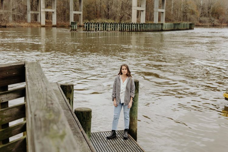 Delia and Denise Howell at the Roanoke River in December 2023 for the installation of the memorial bench for Tremaine, Nikki and Joycegean