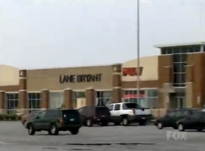 The crime scene parking lot and vehicles as seen after the Lane Bryant homicides.