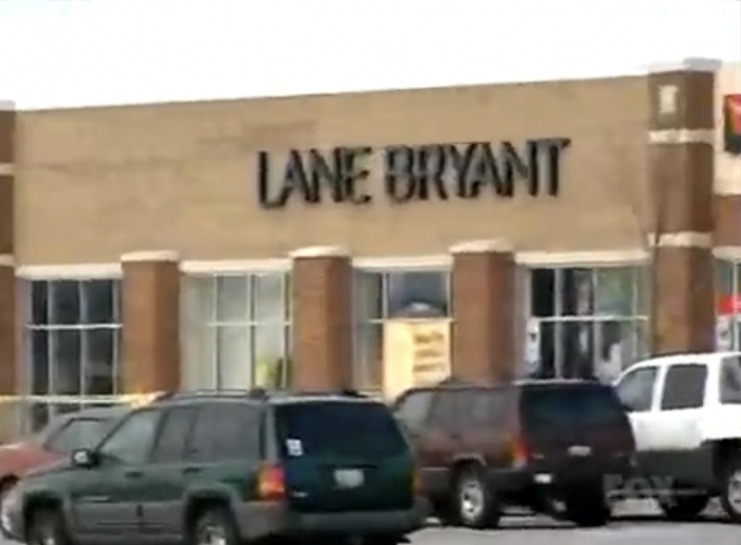 The crime scene parking lot and vehicles as seen after the Lane Bryant homicides.